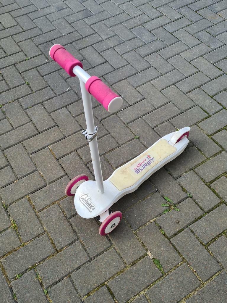 light burst pink and white scooter